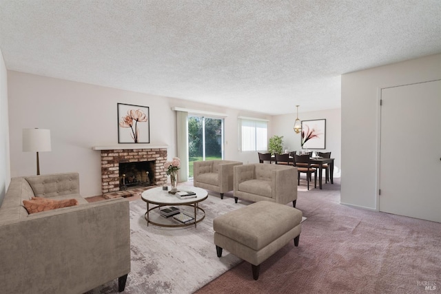 living room with a brick fireplace, a textured ceiling, and carpet flooring