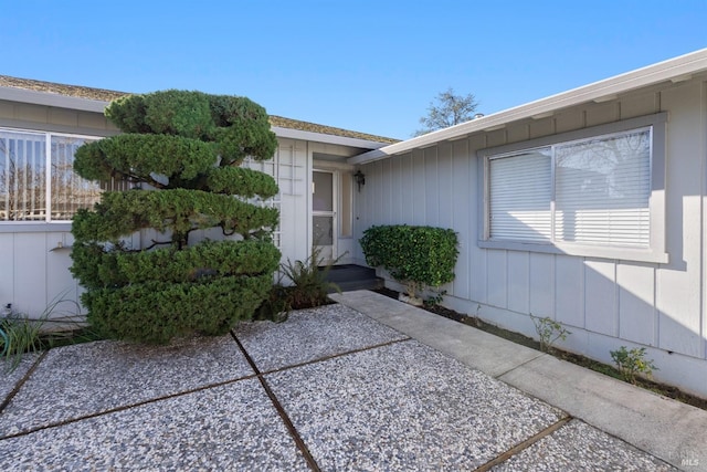 property entrance featuring a patio