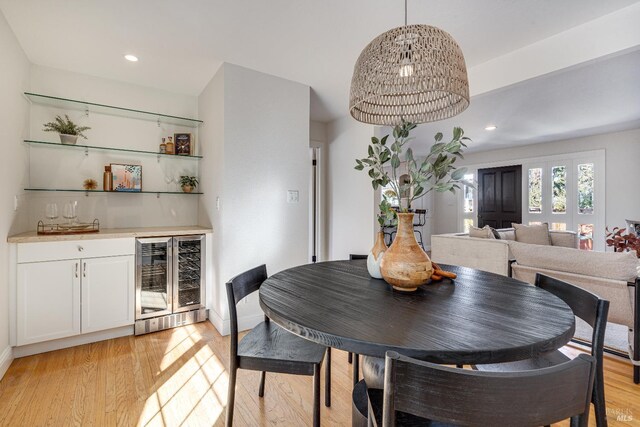1077 Valley View St, Saint Helena, CA 94574 - dining space with wine cooler, bar, light wood-style flooring, and recessed lighting