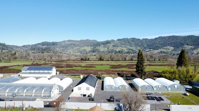 drone / aerial view featuring a mountain view