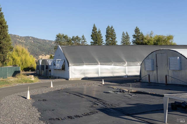 view of outbuilding with an outbuilding and a mountain view