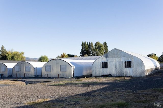 view of front of home with a pole building and an outbuilding