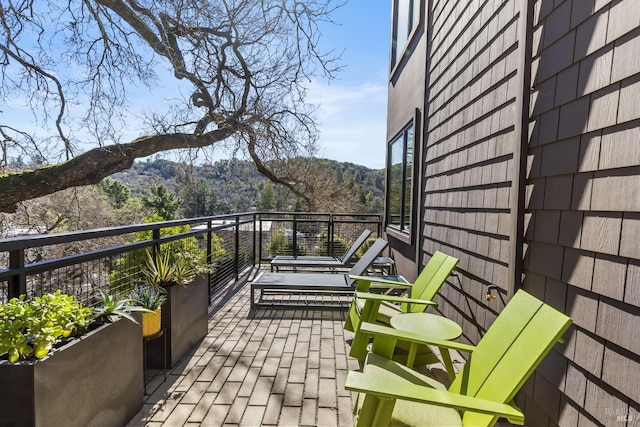 balcony featuring a mountain view