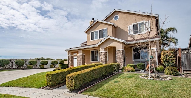 craftsman house featuring stucco siding, driveway, a front lawn, stone siding, and a garage