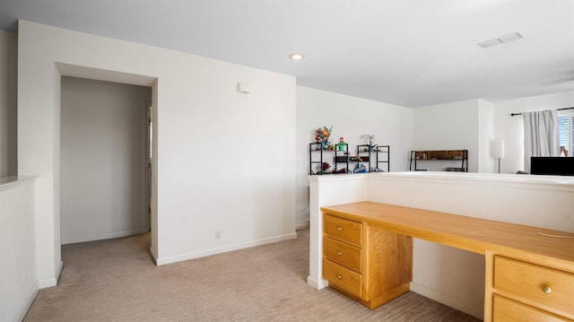 unfurnished bedroom with visible vents, baseboards, light carpet, recessed lighting, and built in study area