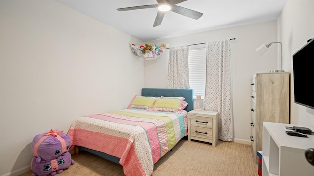 bedroom featuring a ceiling fan, light colored carpet, and baseboards