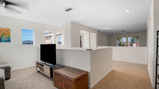 living area featuring recessed lighting, visible vents, carpet floors, and baseboards