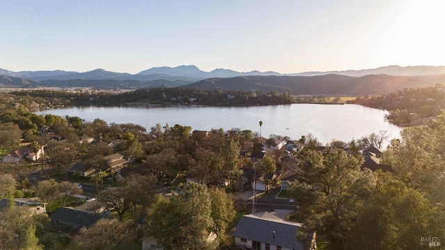 drone / aerial view with a water and mountain view