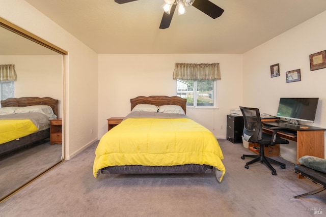 carpeted bedroom featuring a ceiling fan and baseboards