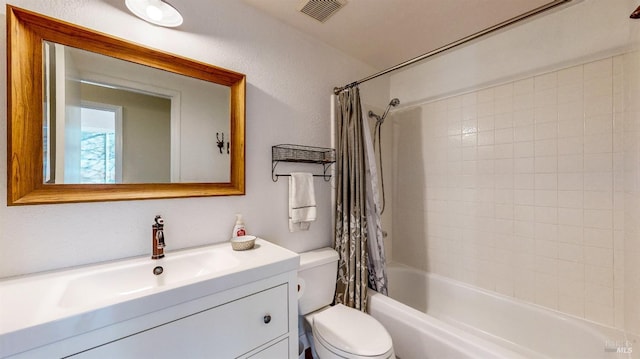 bathroom featuring toilet, shower / bathtub combination with curtain, vanity, and visible vents