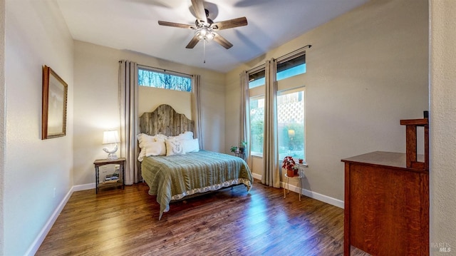 bedroom with baseboards, a ceiling fan, and wood finished floors