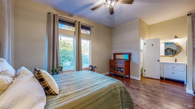 bedroom with dark hardwood / wood-style floors and ceiling fan