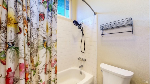 full bath featuring toilet and shower / tub combo with curtain