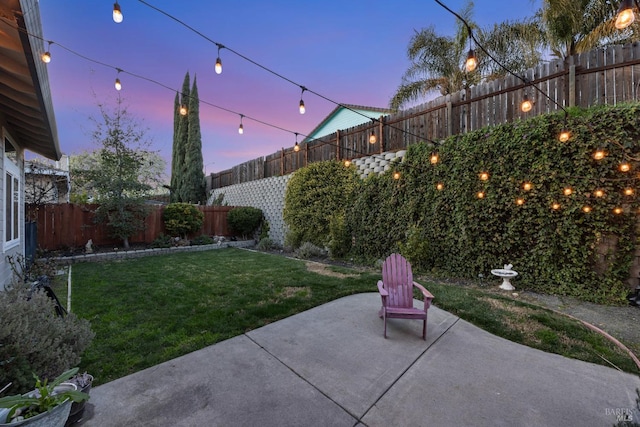 patio terrace at dusk with a yard