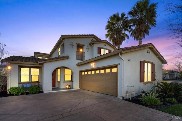 mediterranean / spanish-style home featuring a garage