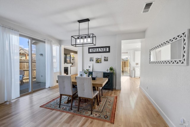 dining area featuring light wood-type flooring