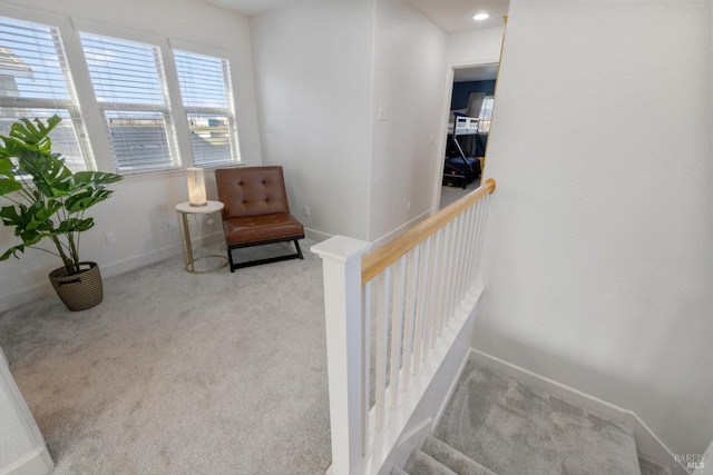 living area featuring light colored carpet