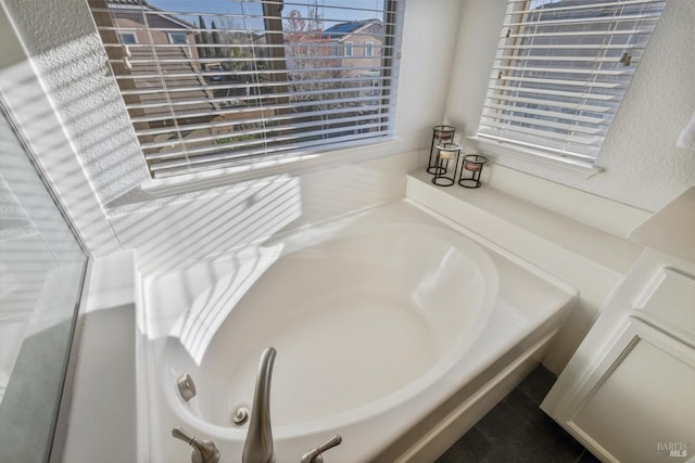 bathroom featuring a washtub