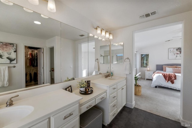 bathroom featuring vanity and tile patterned flooring