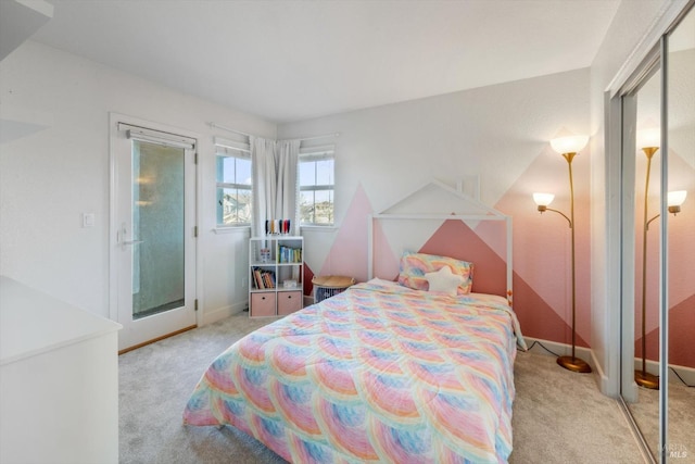 carpeted bedroom featuring access to outside