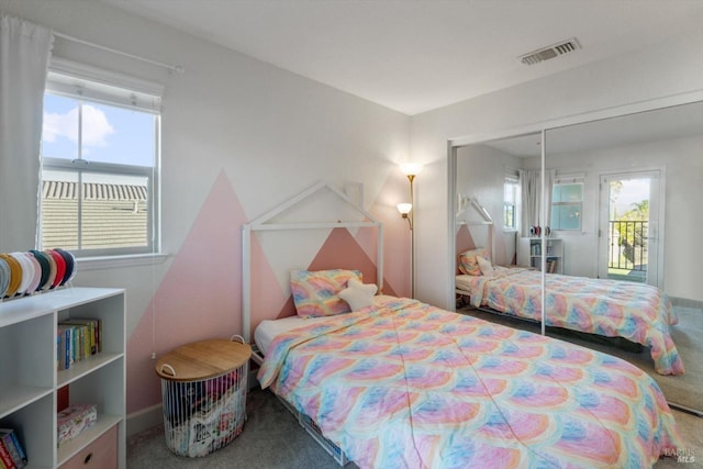 bedroom featuring carpet flooring and a closet