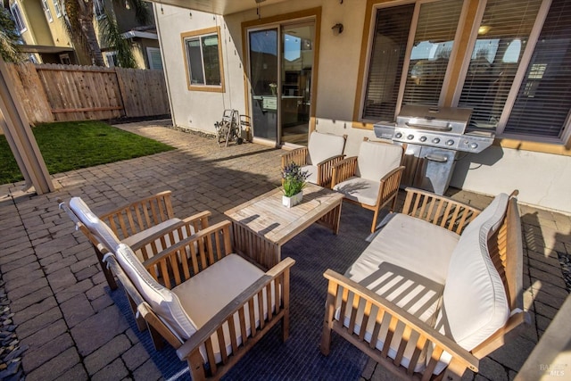 view of patio featuring a grill and outdoor lounge area