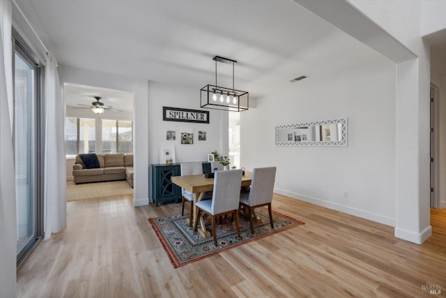 dining space with light wood-type flooring