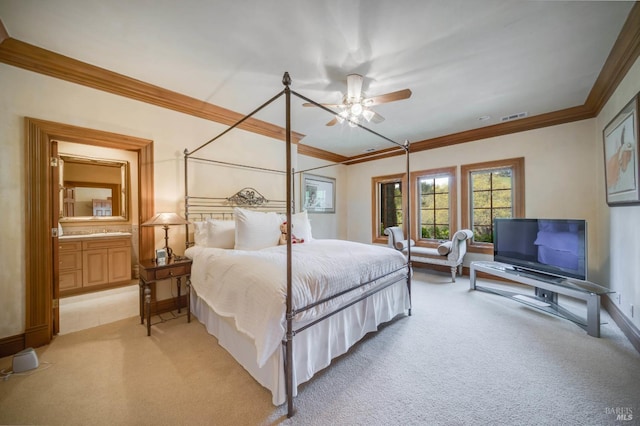 carpeted bedroom featuring crown molding and ceiling fan