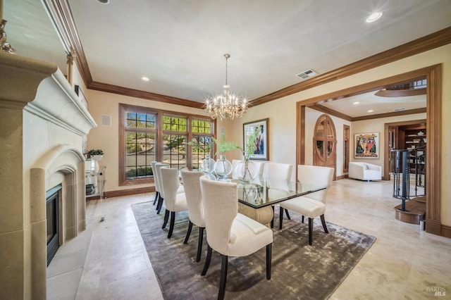 dining space with crown molding and a chandelier