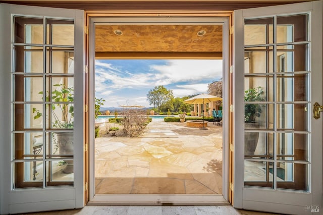 doorway to outside featuring plenty of natural light