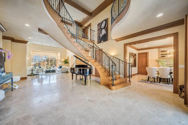 stairs with a towering ceiling and ornamental molding