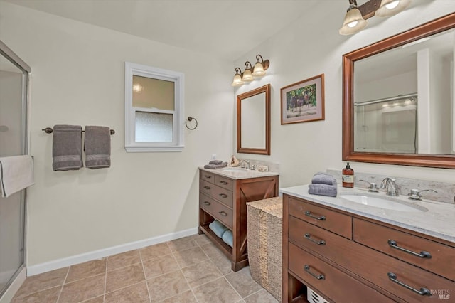 full bathroom featuring baseboards, tile patterned floors, a sink, a shower with shower door, and two vanities