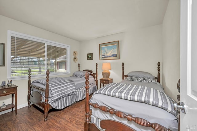 bedroom with dark wood-style floors