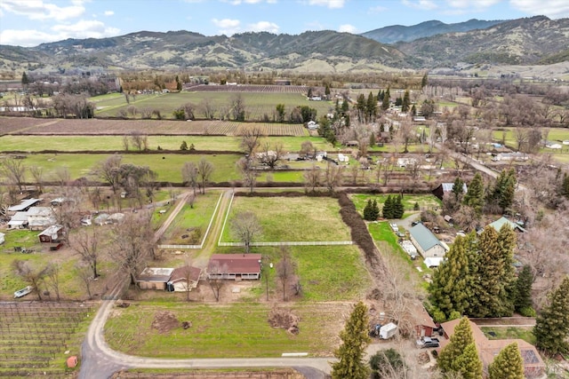 birds eye view of property with a mountain view