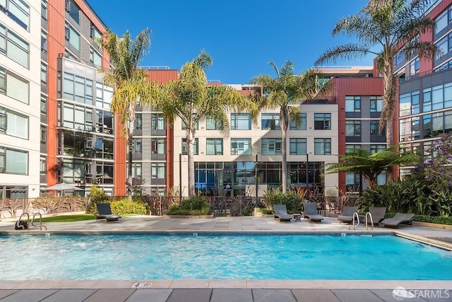 view of swimming pool with a patio