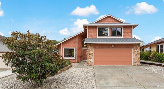 view of front of home featuring concrete driveway, a garage, stone siding, and roof with shingles