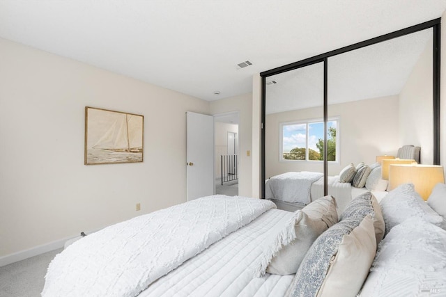 carpeted bedroom featuring a closet