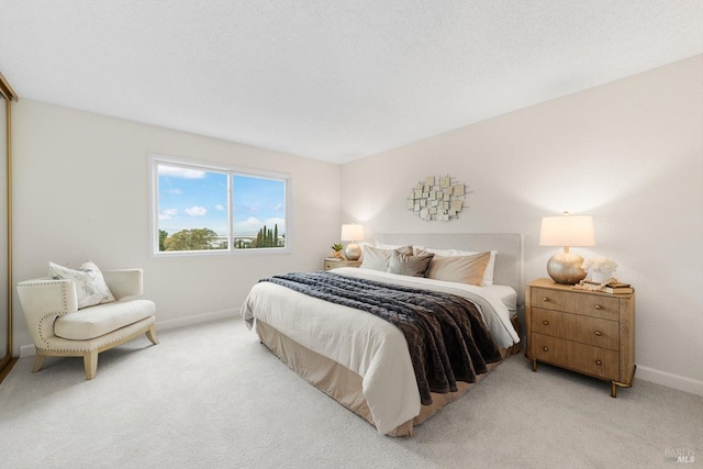 carpeted bedroom with a textured ceiling