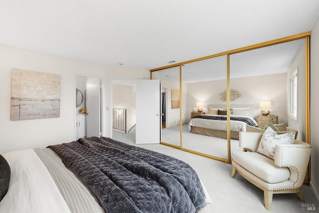 bedroom featuring carpet and a closet