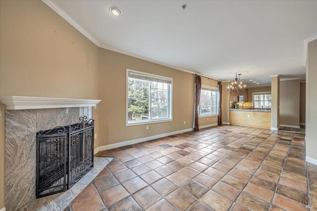 852 Diablo Ave Unit 110, Novato, CA 94947 - unfurnished living room with a chandelier, crown molding, baseboards, and a tile fireplace
