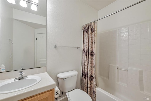 full bathroom featuring vanity, toilet, and shower / tub combo