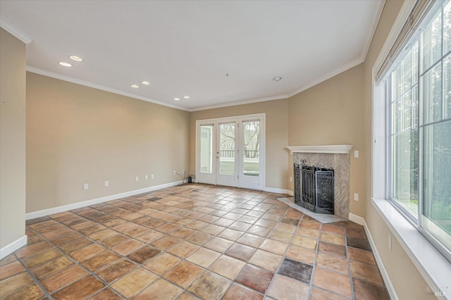 unfurnished living room with crown molding and a high end fireplace