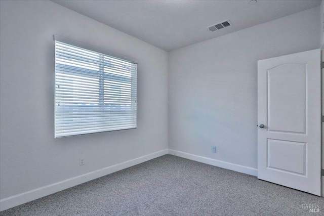 unfurnished room with carpet