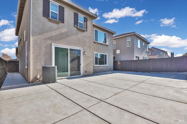 back of property featuring a patio area and central air condition unit