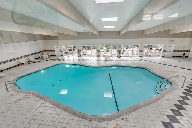 view of pool featuring a skylight