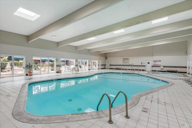 view of swimming pool with a skylight