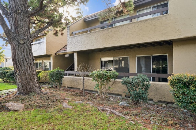 rear view of house featuring a balcony