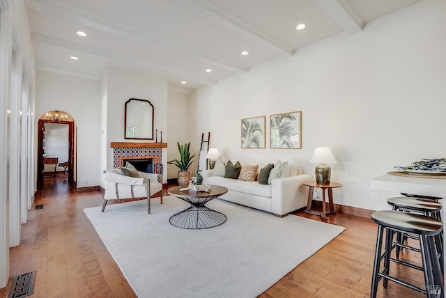 107 Deer Hollow Rd, San Anselmo, CA 94960 - living room featuring beamed ceiling, a tiled fireplace, light wood finished floors, baseboards, and recessed lighting