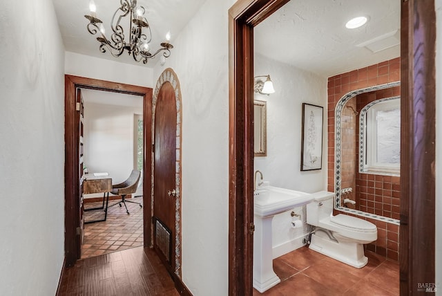 107 Deer Hollow Rd, San Anselmo, CA 94960 - bathroom featuring toilet, a chandelier, bathtub / shower combination, vanity, and tile patterned flooring
