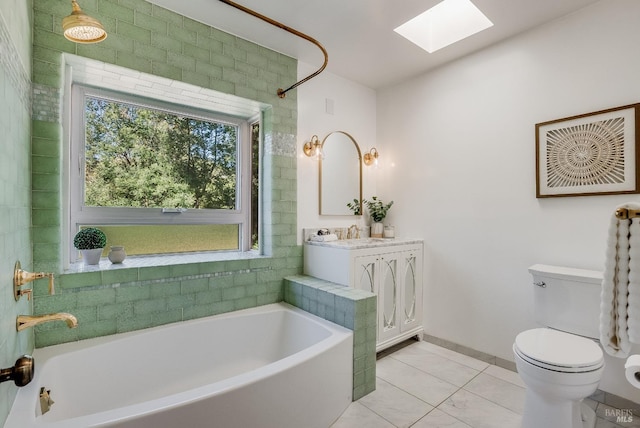 107 Deer Hollow Rd, San Anselmo, CA 94960 - full bath with a skylight, a garden tub, toilet, vanity, and tile patterned floors